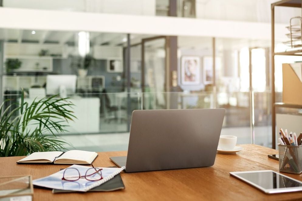 Neatly arranged workspace with computer and office supplies promoting productivity